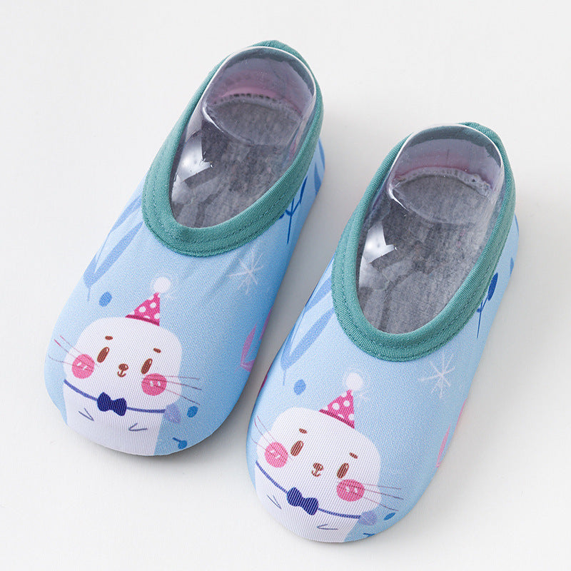 Pair of cartoon cat-themed children's shoes on a light gray background