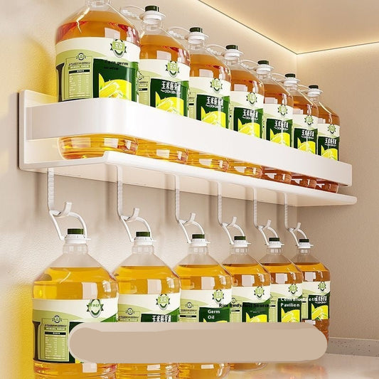 Beverage bottles and boxes on a white shelf with a light background