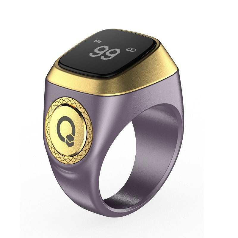 Smart ring with digital display and gold accents on a white background