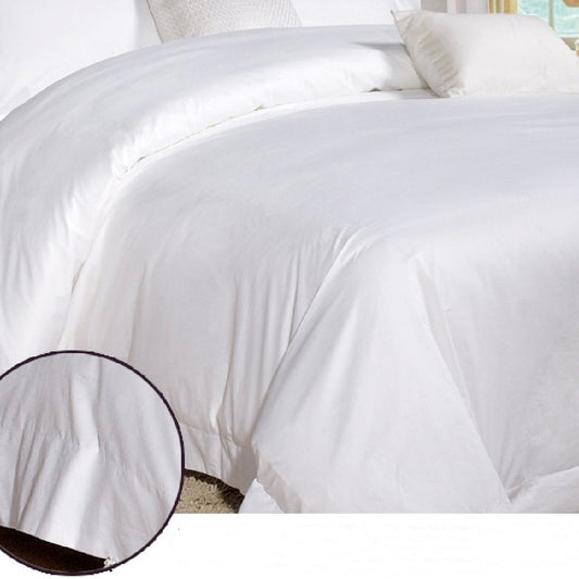 A white cotton bed sheet and quilt cover set on a bed, with bedding neatly arranged on the bed. The room has a minimalistic style with a plain wall and wooden flooring.