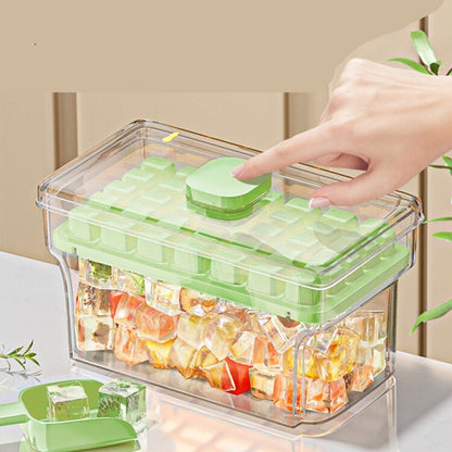 Green and clear container with frozen gummy bears, hand pressing a button on the lid.