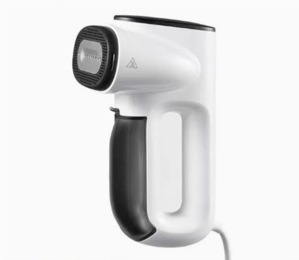White handheld hair dryer with black handle on a white background