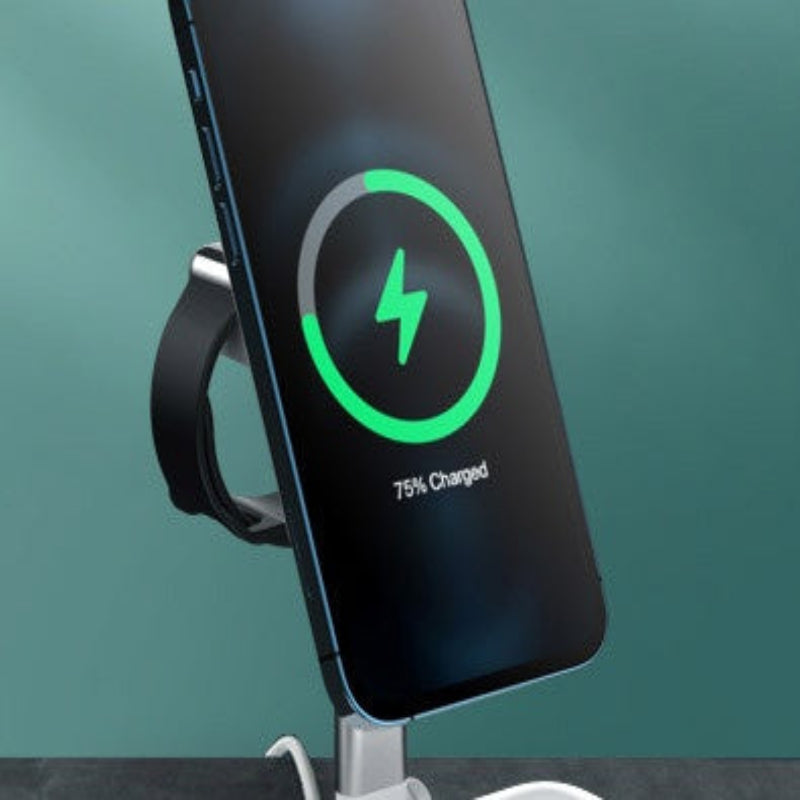 Smartphone with charging display on a stand against a teal background