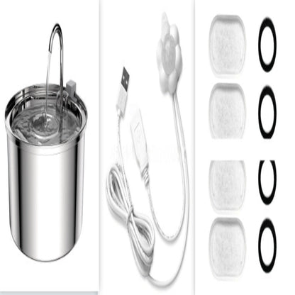 Stainless steel pet water fountain with USB cable and replacement filters on a white background