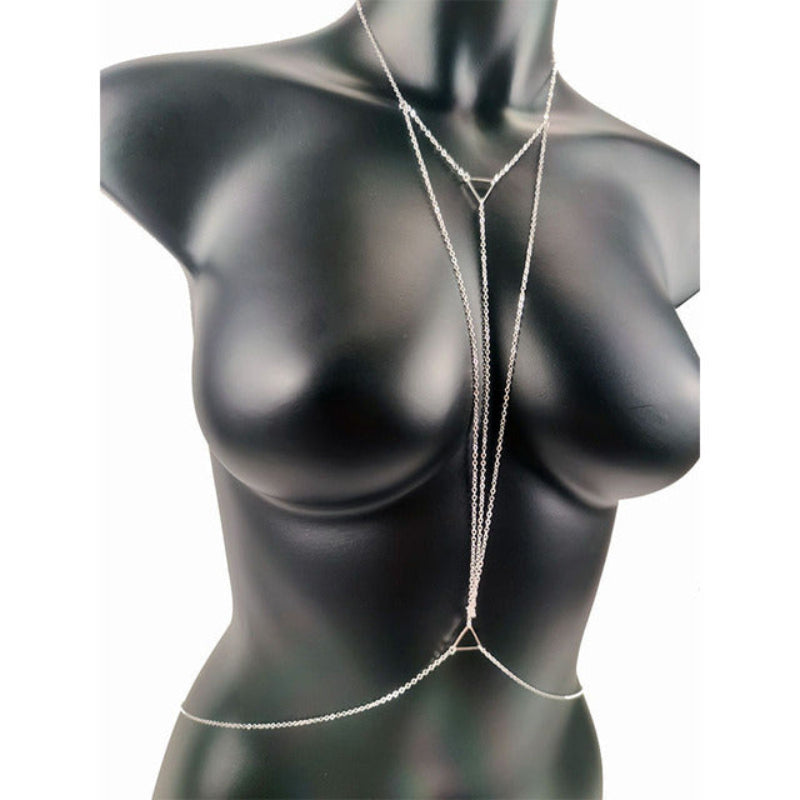 Silver body chain on a black mannequin