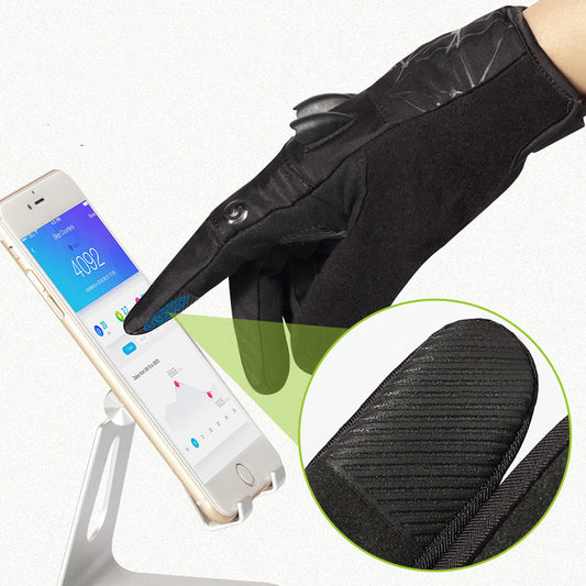 Black touchscreen glove being used to operate a smartphone on a white background