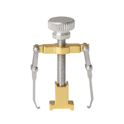 Metal tool with a spring mechanism on a white background