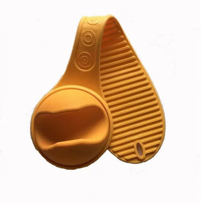Yellow silicone brush and scrubber on a white background