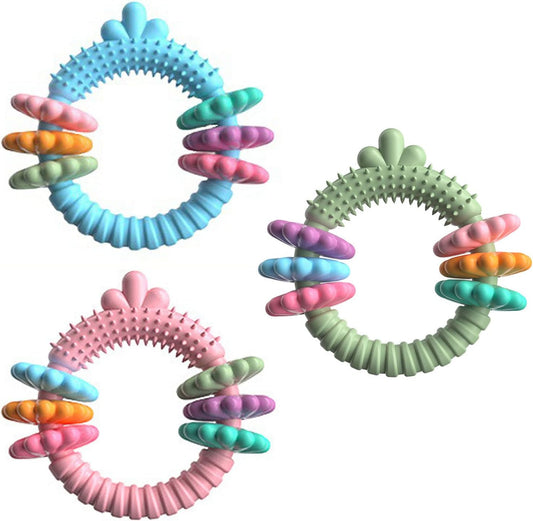 Three colorful rubber rings with textured surface on a white background
