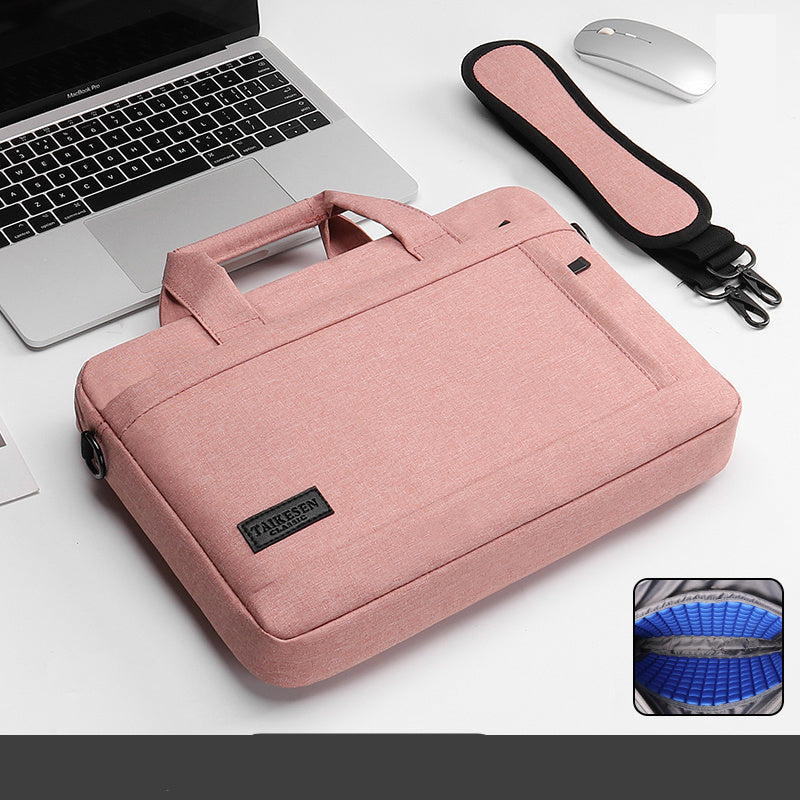 Black laptop bag with a handle and zipper closure, displayed next to a laptop and a mouse, with an inset showing the interior of the bag.