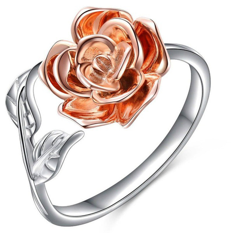 Rose gold rose-shaped ring on a white background