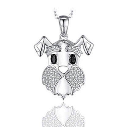 Silver dog-shaped pendant with black eyes on a white background