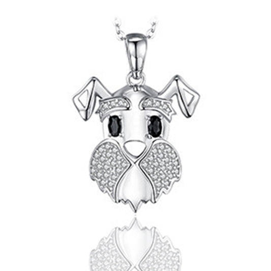 Silver dog-shaped pendant with black eyes on a white background