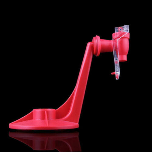 Red plastic device with a hose on a black background