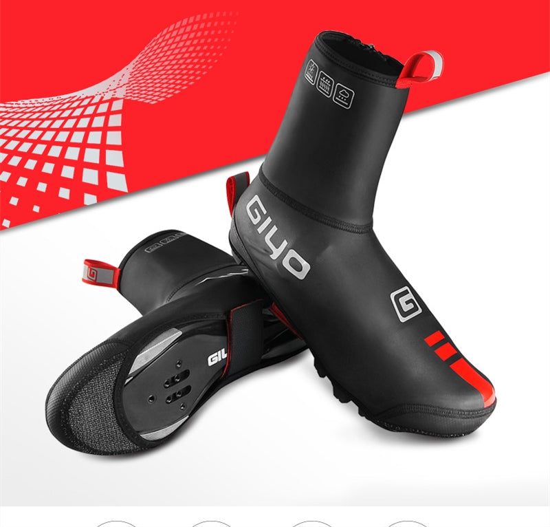Black cycling shoe covers with red accents on a white background