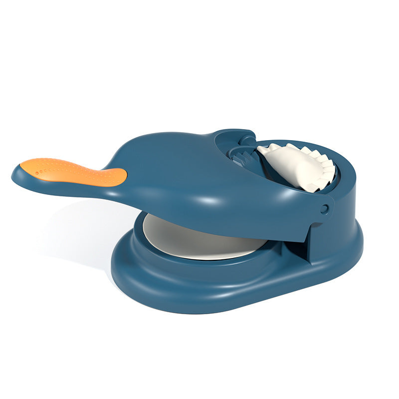 Blue cookie press with orange handle on a white background