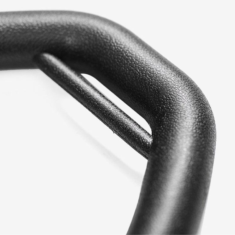 Close-up of a black metal handle on a white background
