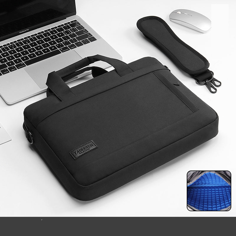 Black laptop bag with a handle and zipper closure, displayed next to a laptop and a mouse, with an inset showing the interior of the bag.