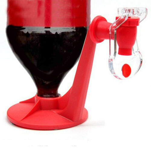 Red and clear plastic drink dispenser with dark liquid inside on a white background