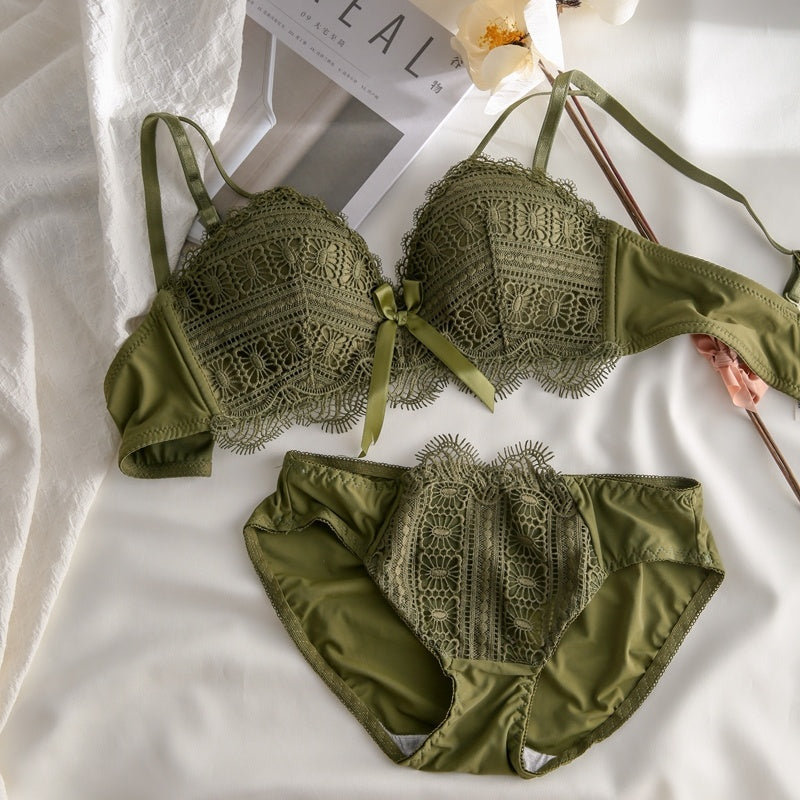 Green lace lingerie set on a white background