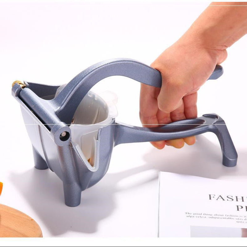 Hand using a gray kitchen tool on a white background