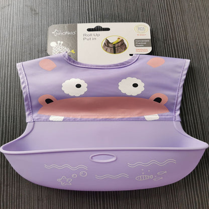 Purple children's bib with cartoon design on a gray surface