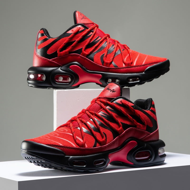 Red and black sneakers on a gray background