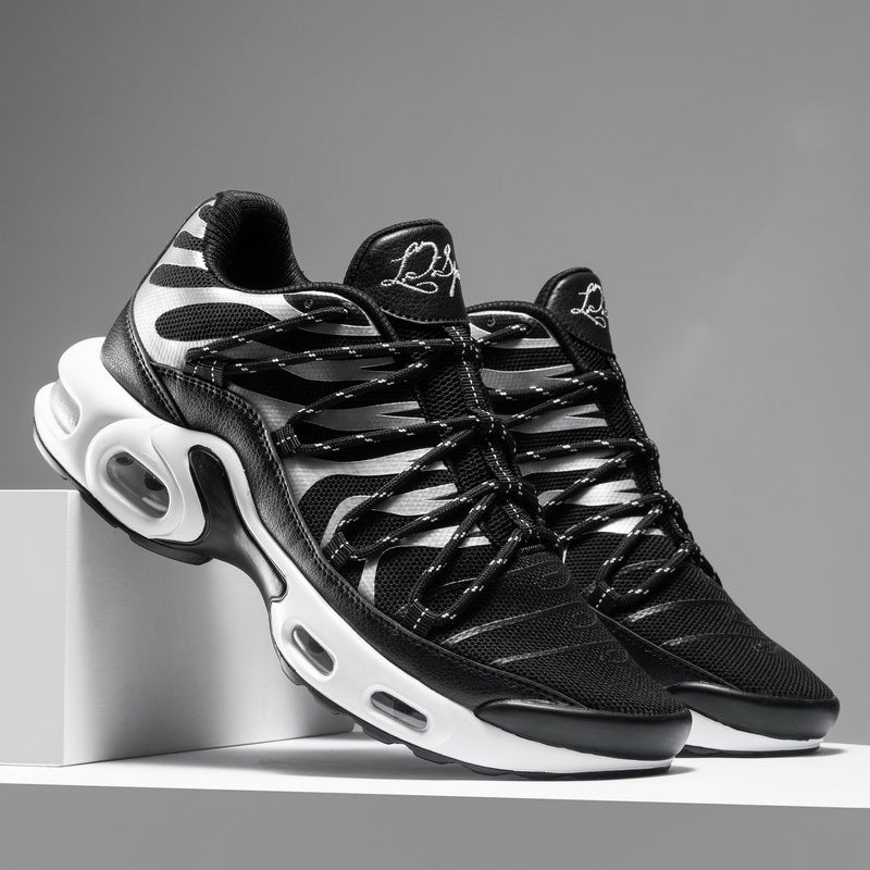 Black and white sneakers on a gray background