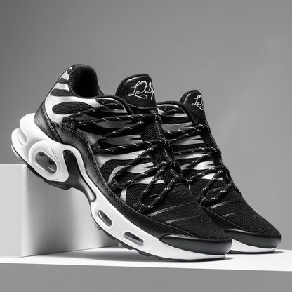 Black and white sneakers on a gray background