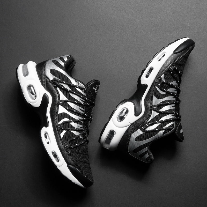Black and white sneakers on a dark gray background