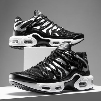 Black and white sneakers with zebra pattern on a gray background