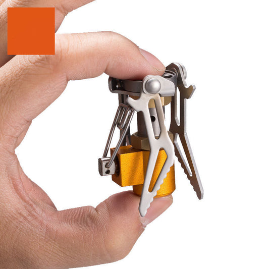 Hand holding a compact multi-tool with various tools on a white background