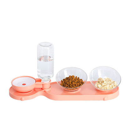 Pet feeding station with water bottle, food bowls, and treats on a white background