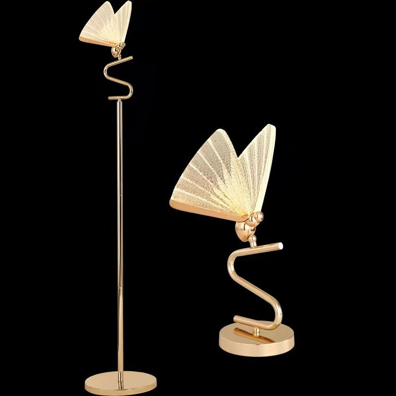 Gold floor lamp with book design on a black background