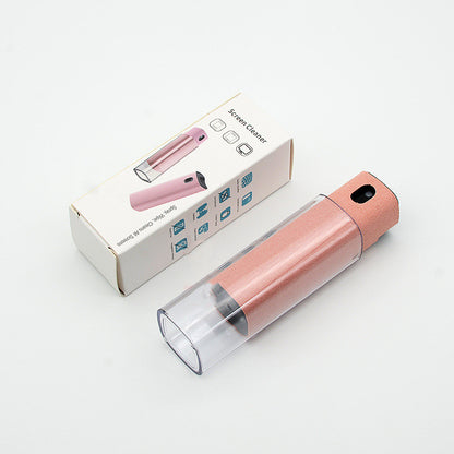 Pink handheld device with clear casing and packaging on a light gray background