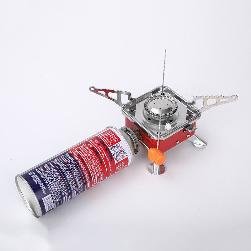 Portable camping stove with a canister on a white background