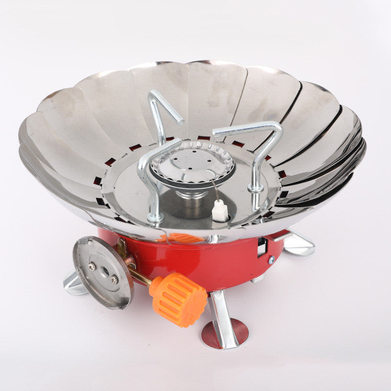 Portable stove with metal bowl and red base on a white background