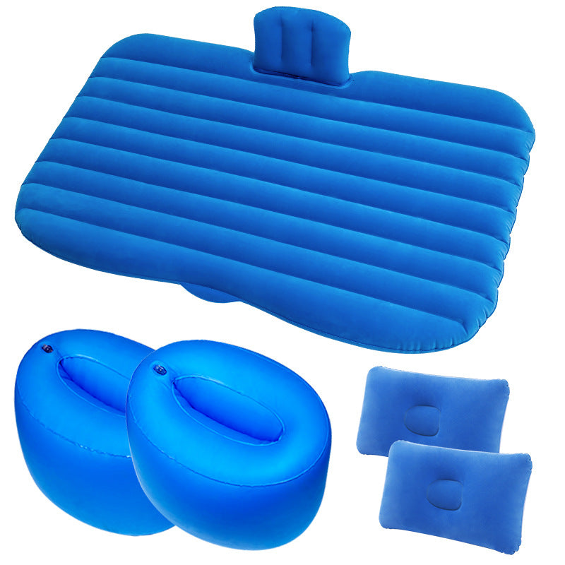 Set of blue inflatable travel pillows and seat cushions on a white background