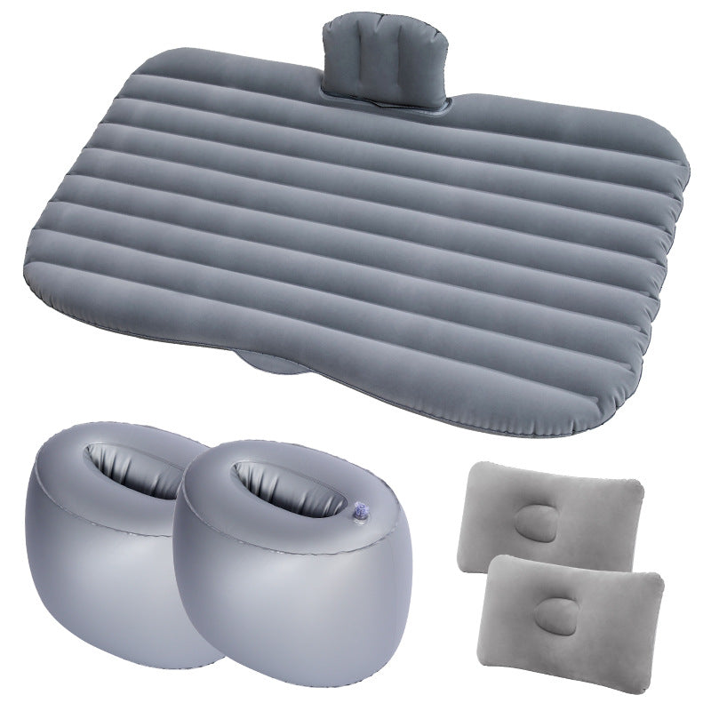 Set of gray inflatable travel pillows and seat cushions on a white background