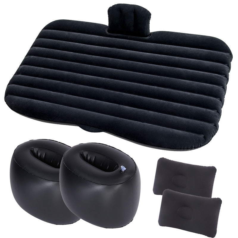 Set of black inflatable travel accessories including a seat pad, headrest, and footrest on a white background.