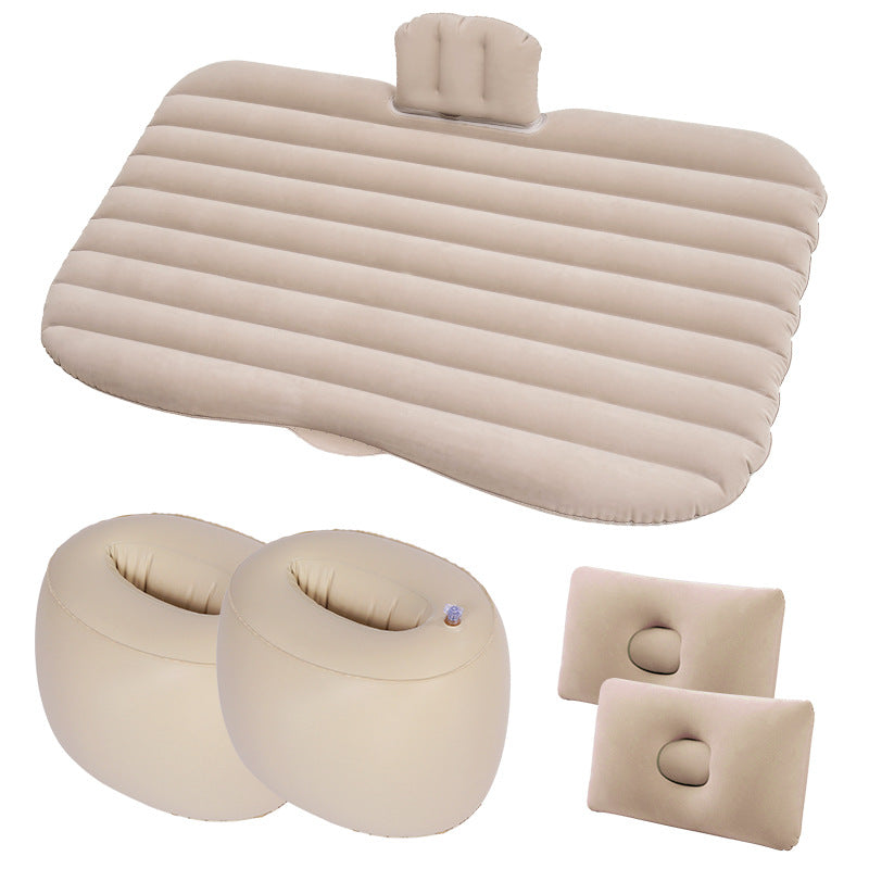 Set of beige inflatable travel pillows and seat cushions on a white background
