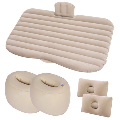 Set of beige inflatable travel pillows and seat cushions on a white background