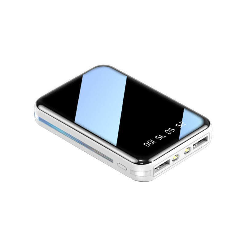 Portable phone charger with a reflective surface on a white background