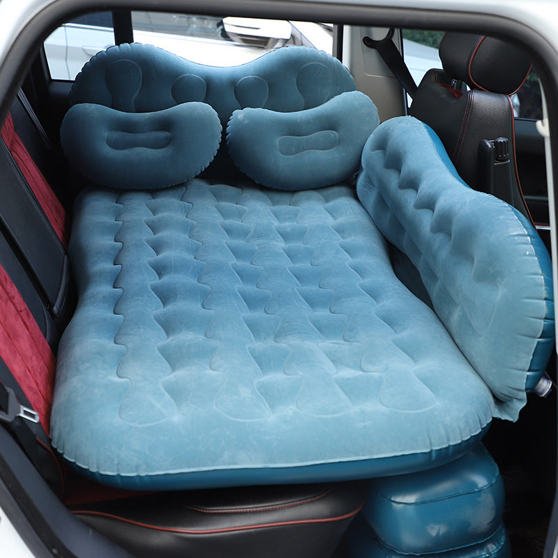 Inflatable car mattress with headrests in a vehicle