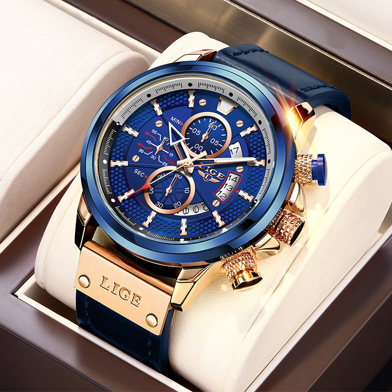 Luxury watch with blue face and gold accents in a white box