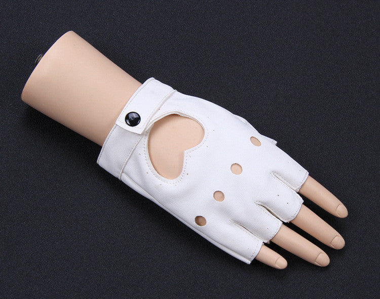 A pair of white half-finger gloves with heart cut-outs, displayed on a mannequin hand against a black background.