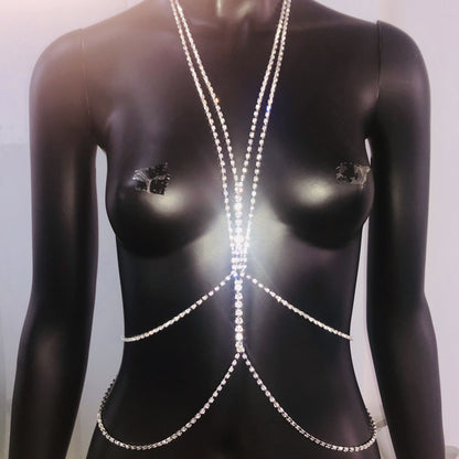 A silver rhinestone body chain displayed on a mannequin's torso.
