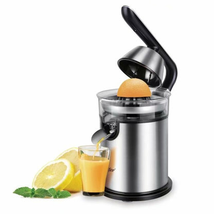 Manual citrus juicer with an orange being juiced, a glass of juice, and lemons on a white background.