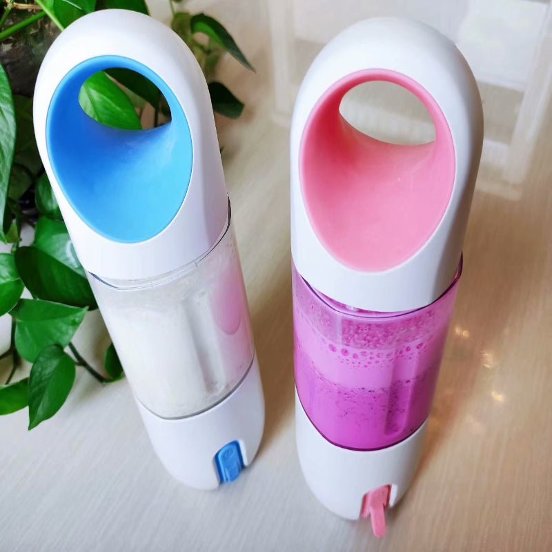 Two colorful water bottles with blue and pink lids on a light surface.