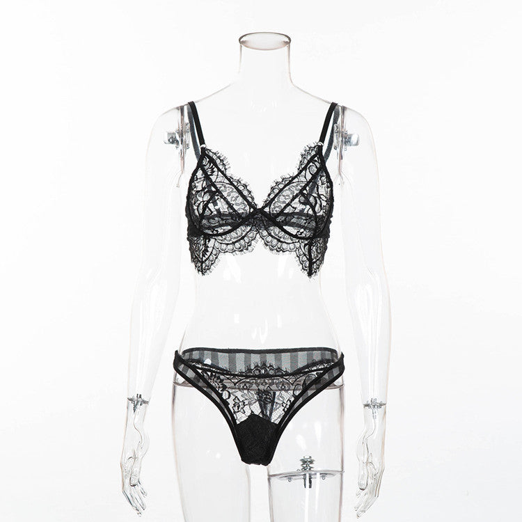 Black lace lingerie set on a mannequin against a white background